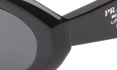 Shop Prada 56mm Oval Sunglasses In Black