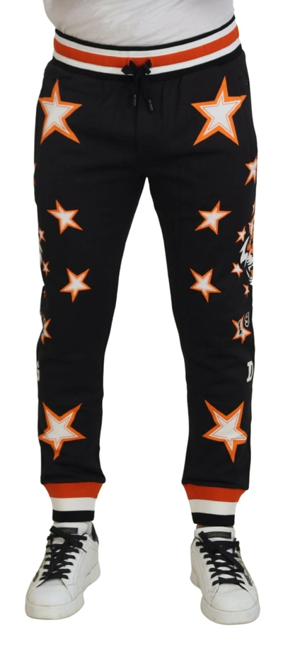 Shop Dolce & Gabbana Black Orange Star Trousers Sport Pants