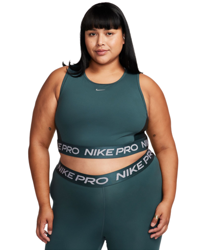 Shop Nike Plus Size Dri-fit Cropped Tank Top In Deep Jungle,metallic Silver