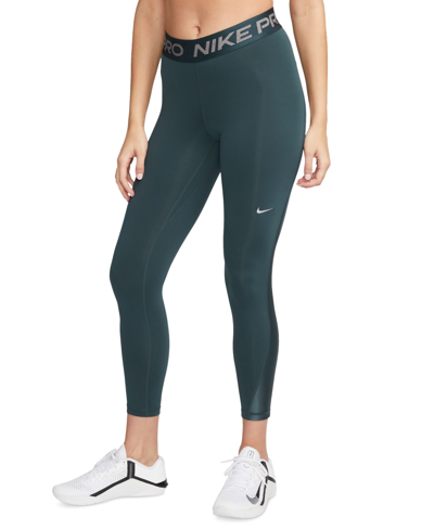 Shop Nike Women's Pro Mid-rise 7/8 Leggings In Deep Jungle,metallic Silver