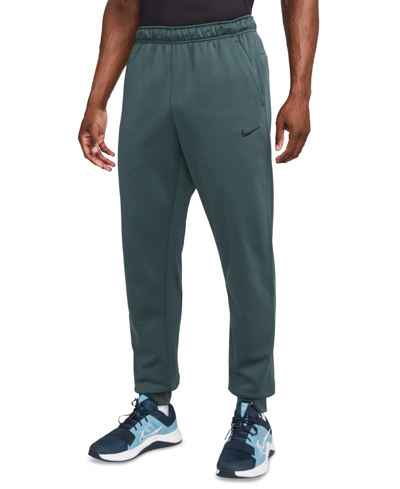 Shop Nike Men's Therma-fit Tapered Fitness Pants In Deep Jungle,black