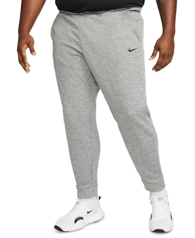 Shop Nike Men's Therma-fit Tapered Fitness Pants In Dark Grey Heather,black