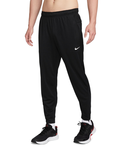 Shop Nike Men's Totality Dri-fit Tapered Versatile Pants In Black,white