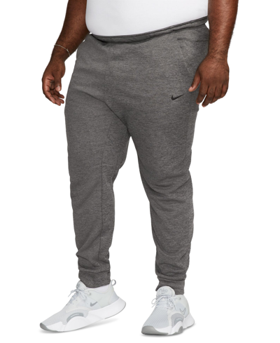 Shop Nike Men's Therma-fit Tapered Fitness Pants In Charcoal Heather,black