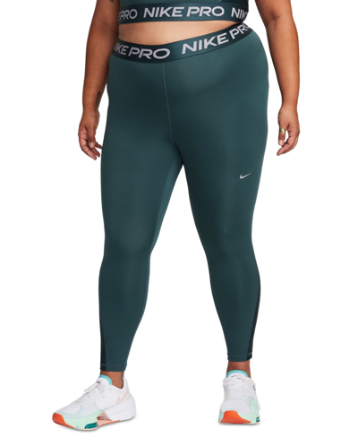 Shop Nike Plus Size Mid-rise 7/8 Leggings In Deep Jungle,metallic Silver