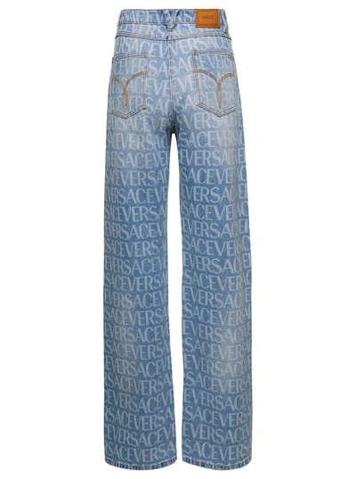 Shop Versace Light Blue Jeans With All-over Logo Print In Cotton Denim Woman