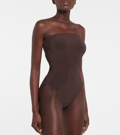 Shop Norma Kamali Bishop Strapless Swimsuit In Brown