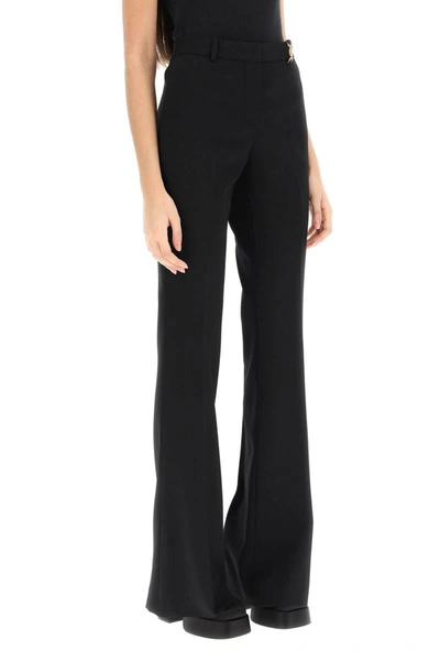 Shop Versace Wool Flared Pants With Medusa Detail In Black