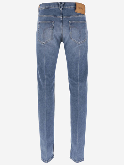 Shop Versace Cotton Blend Denim Jeans