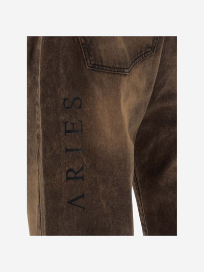 Shop Aries Bleached Jeans With Logo In Red