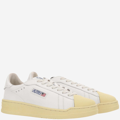 Shop Autry Bob Lutz Leather Sneakers In White