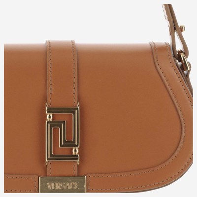 Shop Versace Greca Goddess Mini Leather Bag In Brown