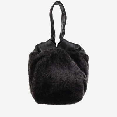 Shop Jil Sander Leather And Shearling Bag In Black
