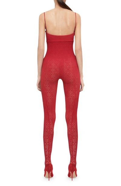 Shop Wolford Intricate Sheer Pattern Thong Stirrup Jumpsuit In Autumn Red