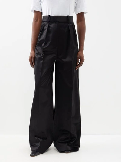 Shop Khaite Teyana Pleated Cotton-blend Trousers In Black