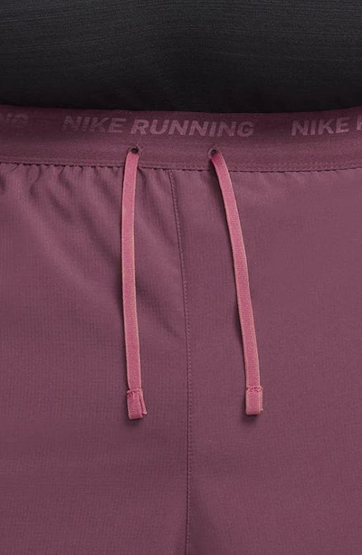 Shop Nike Dri-fit Stride 2-in-1 Running Shorts In Night Maroon/ Black/ Cedar