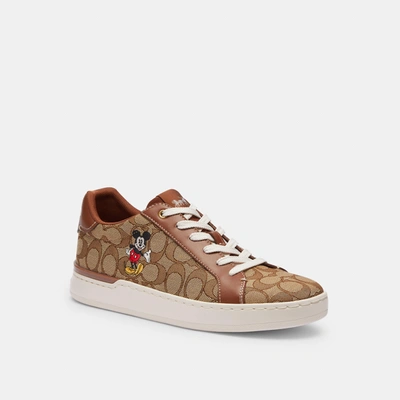 Shop Coach Outlet Disney X Coach Clip Low Top Sneaker In Signature Jacquard With Mickey Mouse In Green