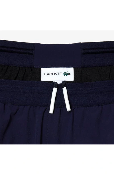 Shop Lacoste Colorblock Cotton Swim Trunks In Yun Navy Blue/ Green-flour