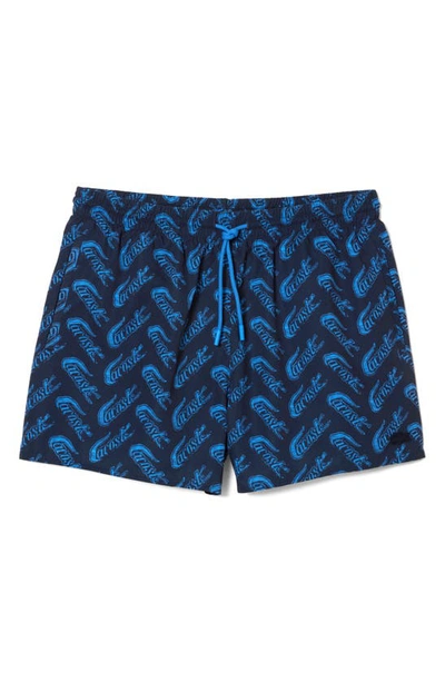 Shop Lacoste Logo Print Cotton Swim Trunks In F65 Navy Blue/ Ethereal