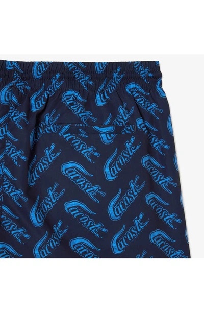 Shop Lacoste Logo Print Cotton Swim Trunks In F65 Navy Blue/ Ethereal