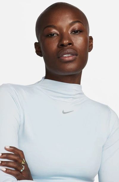 Shop Nike Dri-fit One Luxe Mock Neck Crop Top In Blue Tint