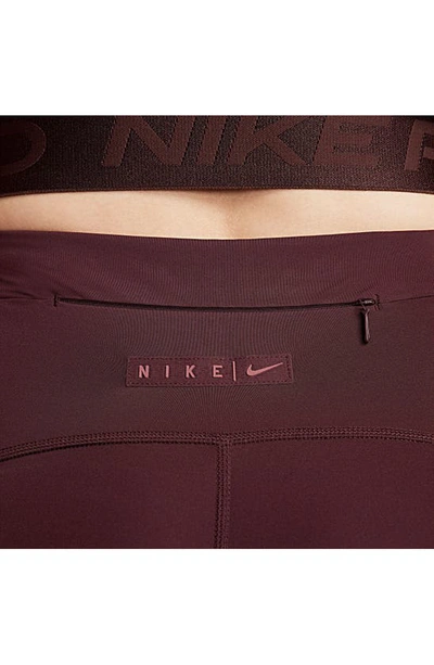 Shop Nike Pro High Waist Pocket Leggings In Burgundy Crush/ Cedar