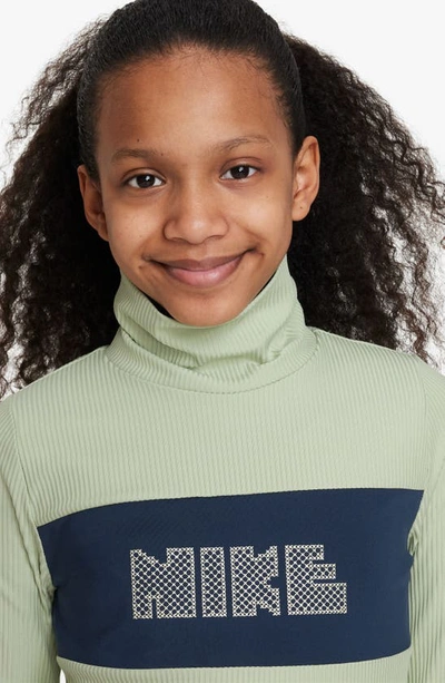 Shop Nike Kids' Sportswear Dri-fit Long Sleeve Logo Top In Honeydew/ Navy/ Coconut Milk