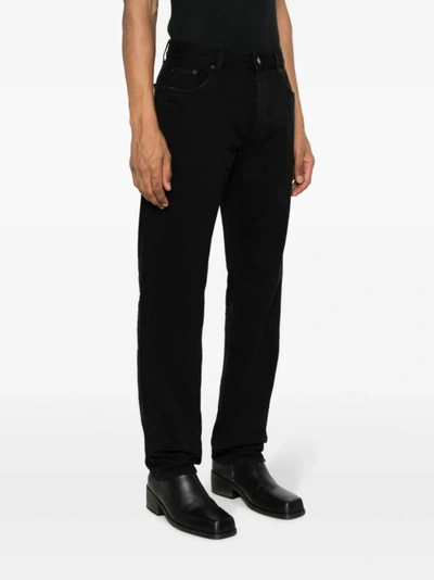 Shop Saint Laurent Straight Cut Jeans In Black