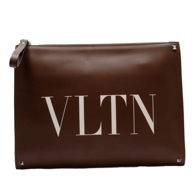 Shop Valentino Vltn Leather Clutch Bag () In Brown