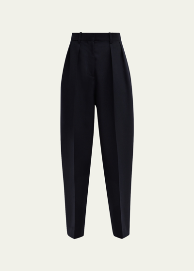 Shop The Row Corby Pleated Tapered Wool Pants In Deep Sea
