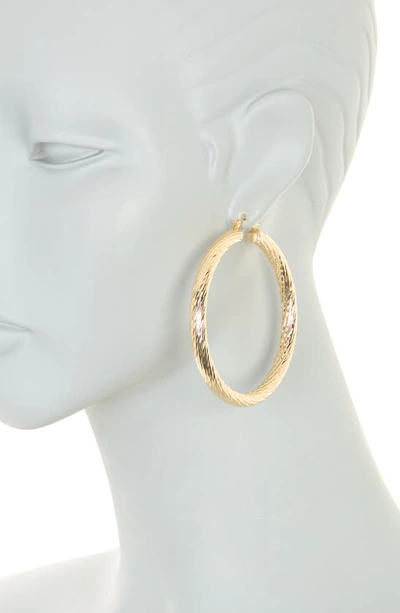Shop Natasha Textured Hoop Earrings In Gold