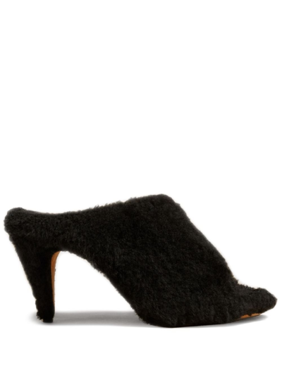 Shop Khaite The Marion 90mm Shearling Mules In Brown