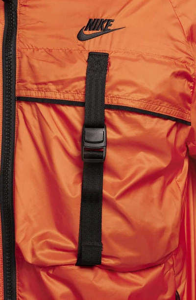 Shop Nike N24 Packable Recycled Polyester Jacket In Campfire Orange/ Black