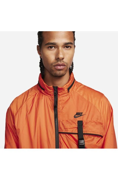 Shop Nike N24 Packable Recycled Polyester Jacket In Campfire Orange/ Black