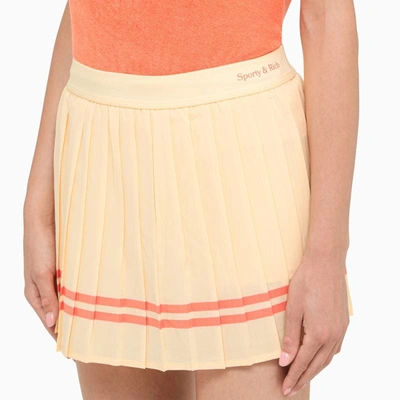 Shop Sporty And Rich Sporty & Rich Almond Pleated Miniskirt In Beige