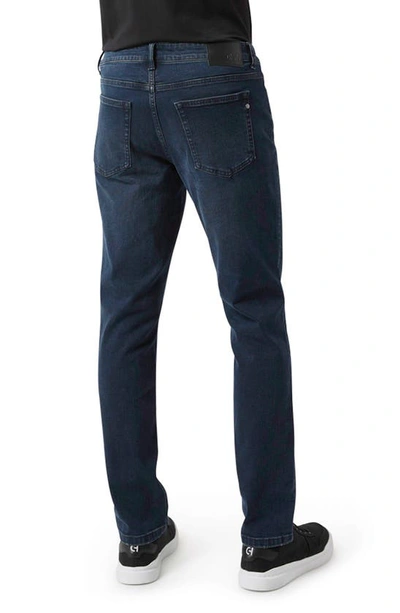 Shop Dkny Bedford Slim Jeans In Blue Black