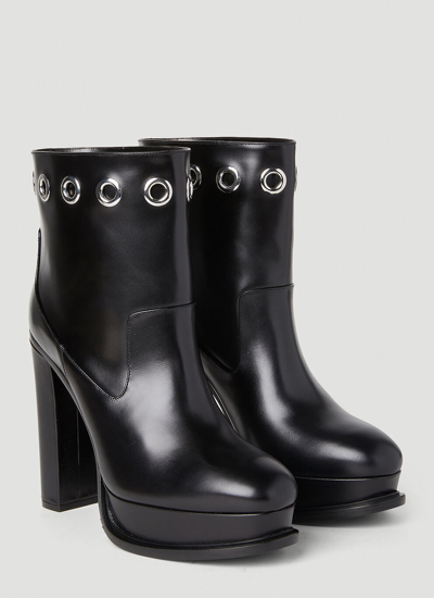 Shop Alexander Mcqueen Women Eyelet Heeled Boots In Black