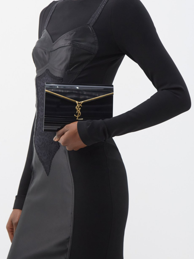 Shop Saint Laurent Women Mini Cassandra Plexiglass Bag In Black