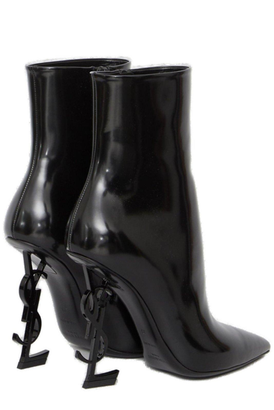 Shop Saint Laurent Opyum Logo Plaque Pointed Toe Boots In Black