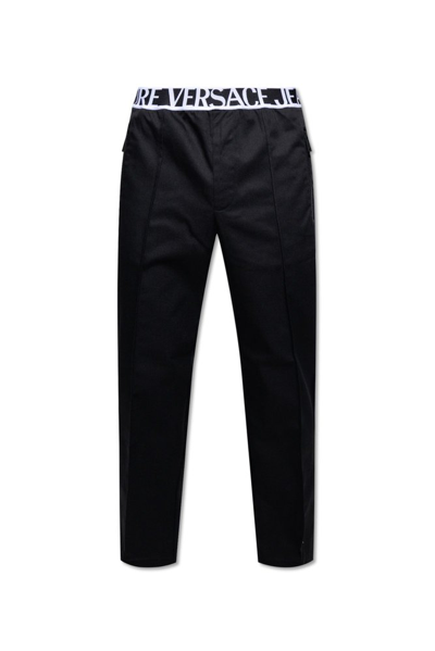 Shop Versace Jeans Couture Logo Waistband Trousers In Black