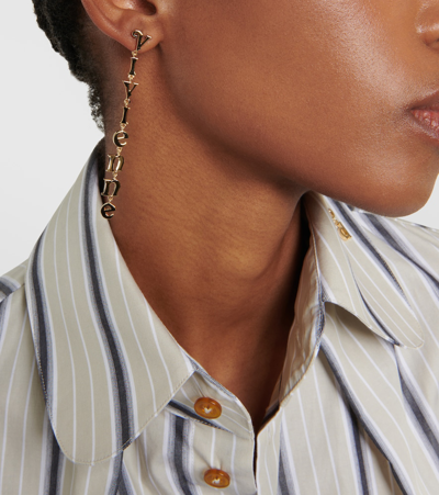Shop Vivienne Westwood Raimunda Logo Drop Earrings In Gold