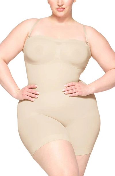 Skims Seamless Sculpt Strapless Shortie Bodysuit In Sand