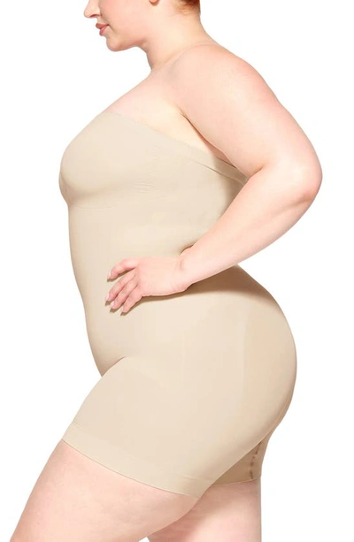 Skims Seamless Sculpt Strapless Shortie Bodysuit In Sand