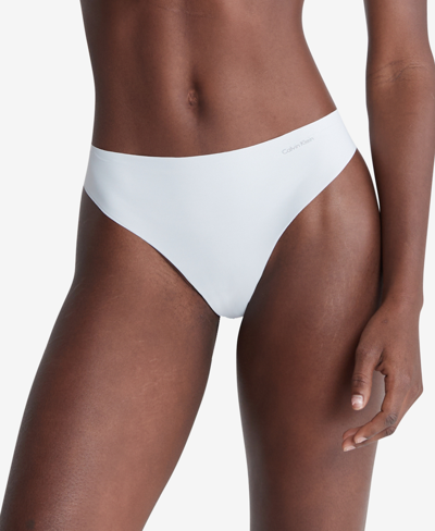 Shop Calvin Klein Women's Invisibles Thong Underwear D3428 In Arctic Ice