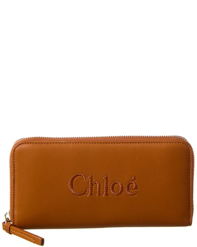 Shop Chloé Sense Leather Zip Around Wallet In Orange