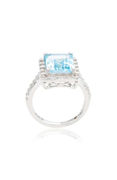 Shop Suzy Levian Sterling Silver Emerald Cut Blue Topaz & White Topaz Halo Ring