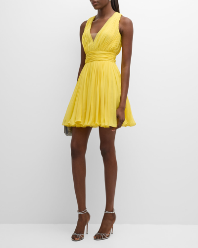 Shop Giambattista Valli Plunging Pleated Sleeveless Silk Georgette Mini Dress In Solid Yellow