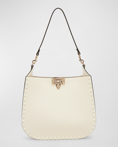 Shop Valentino Small Rockstud Leather Hobo Bag In Ivory