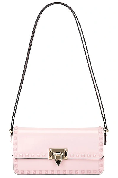 Shop Valentino East West Rockstud Shoulder Bag In Rose Quartz