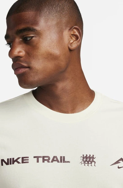 Shop Nike Trail Dri-fit Graphic T-shirt In Coconut Milk
